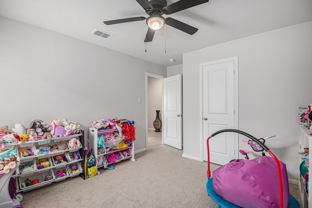 recreation room featuring ceiling fan and light carpet