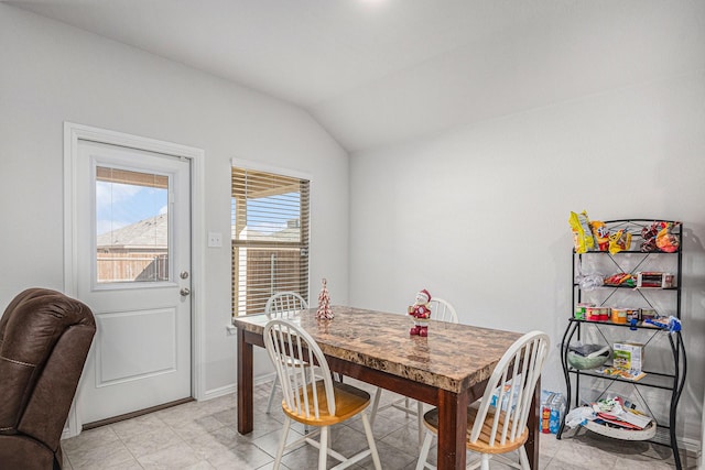 dining room with lofted ceiling