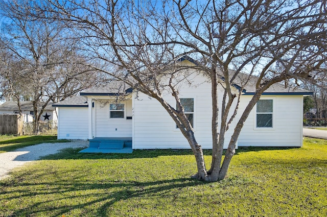 rear view of house with a lawn