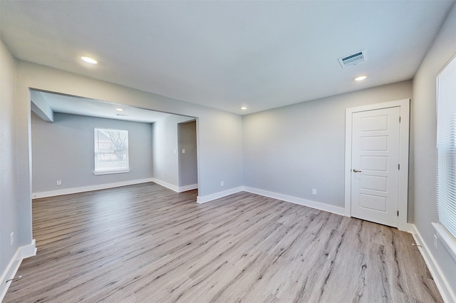 unfurnished room featuring light wood-type flooring