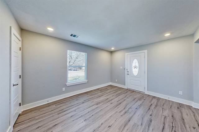 entryway with light hardwood / wood-style floors