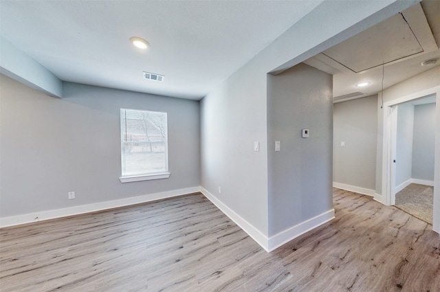 empty room with light hardwood / wood-style floors