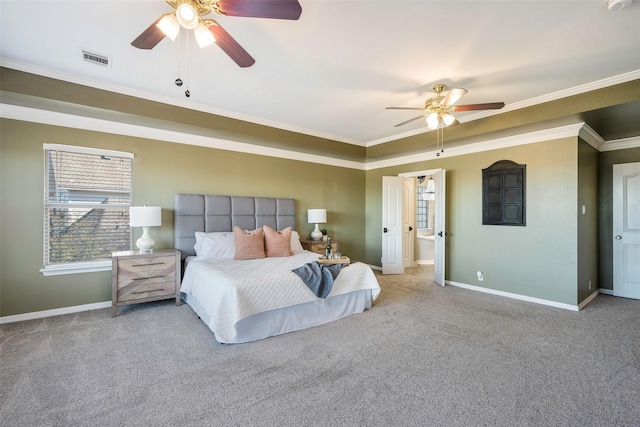 bedroom with ceiling fan, light colored carpet, ornamental molding, and ensuite bath