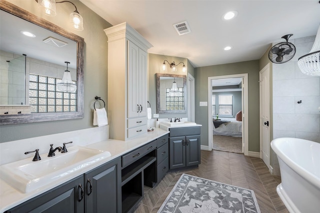 bathroom with vanity and a bathtub