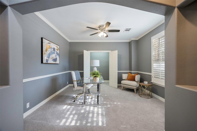 interior space featuring ornamental molding, carpet, and ceiling fan