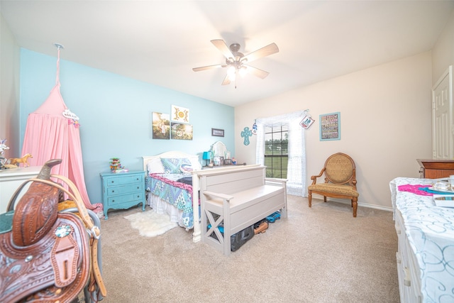 bedroom featuring ceiling fan and light carpet