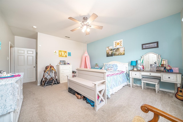 bedroom featuring light carpet and ceiling fan