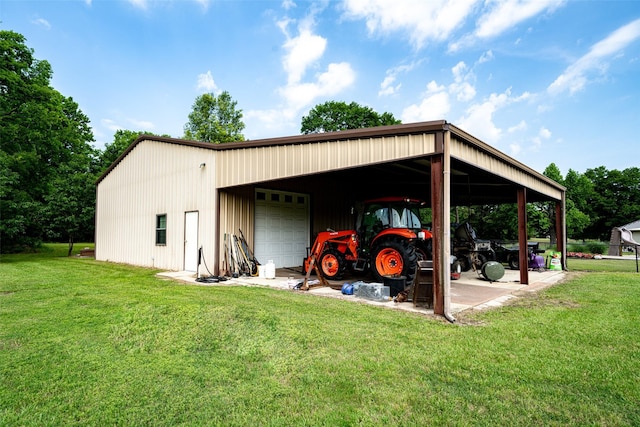 view of outdoor structure with a garage and a yard