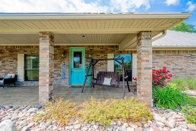 entrance to property with a patio area