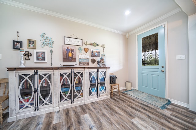 entrance foyer with crown molding and wood-type flooring