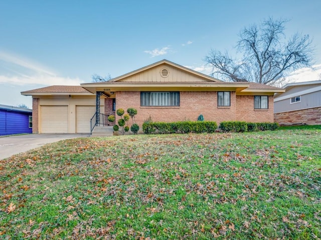 single story home featuring a garage and a front lawn