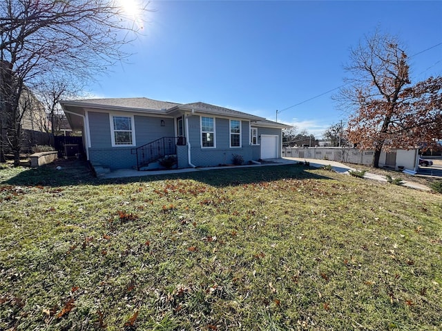 view of front of house with a garage and a front yard