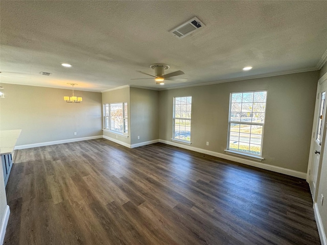 spare room with crown molding, dark hardwood / wood-style floors, ceiling fan with notable chandelier, and a textured ceiling