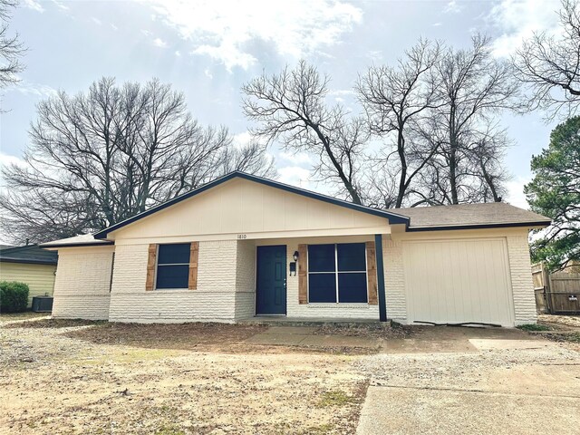 single story home with a garage