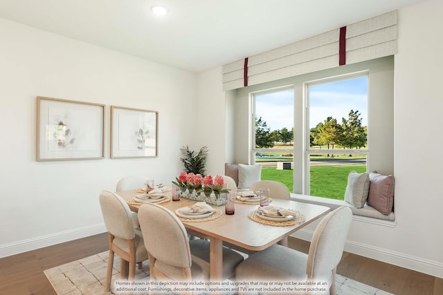 dining space featuring hardwood / wood-style floors