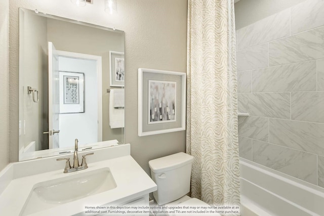 full bathroom featuring shower / tub combo with curtain, vanity, and toilet