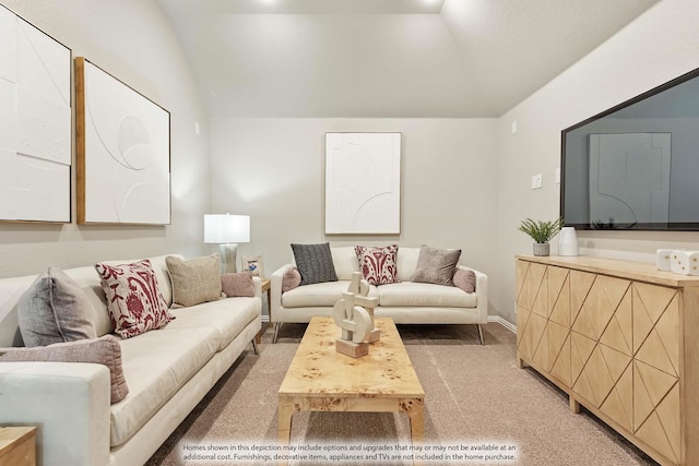 carpeted living room featuring vaulted ceiling