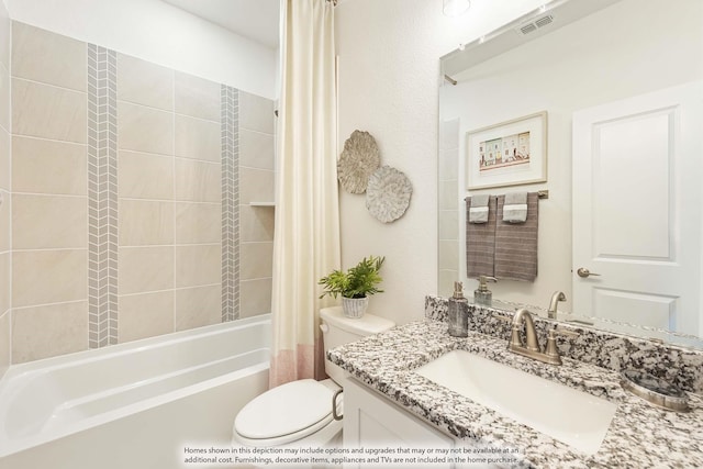 full bathroom featuring vanity, shower / bath combo, and toilet