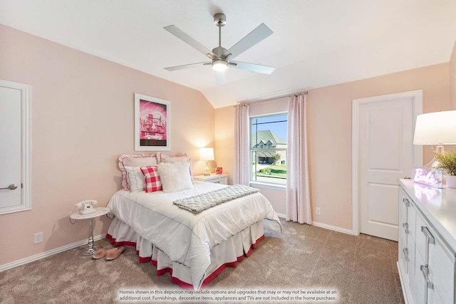 carpeted bedroom with vaulted ceiling and ceiling fan