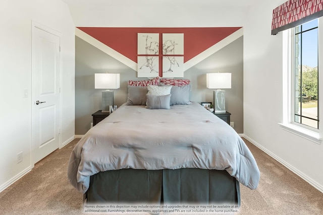 carpeted bedroom featuring lofted ceiling