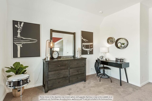 office space with light colored carpet and lofted ceiling