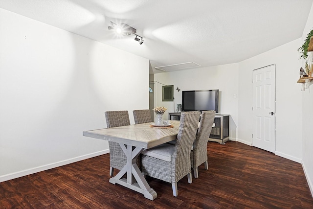 dining space with dark hardwood / wood-style flooring