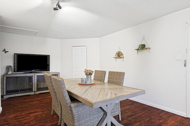 dining room with dark hardwood / wood-style flooring