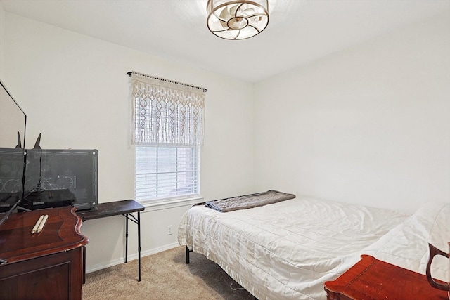 bedroom featuring light colored carpet