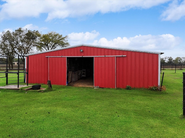 view of outdoor structure with a yard