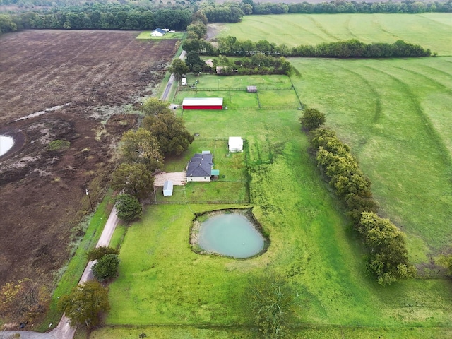 aerial view with a water view and a rural view