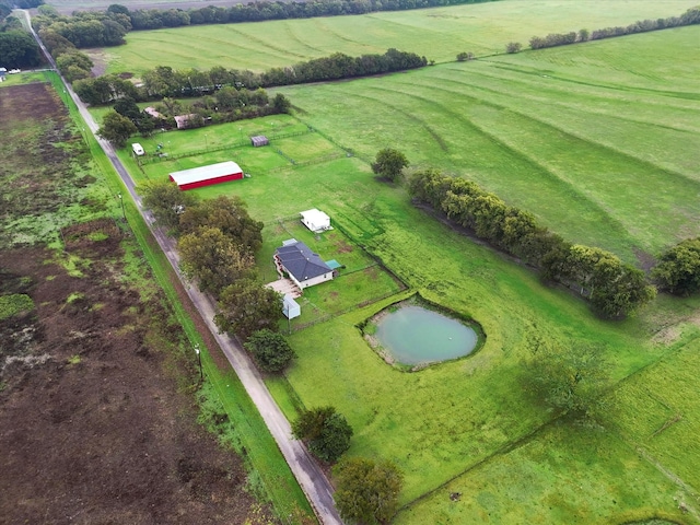 drone / aerial view with a rural view and a water view