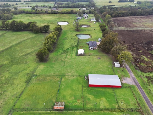 birds eye view of property featuring a rural view