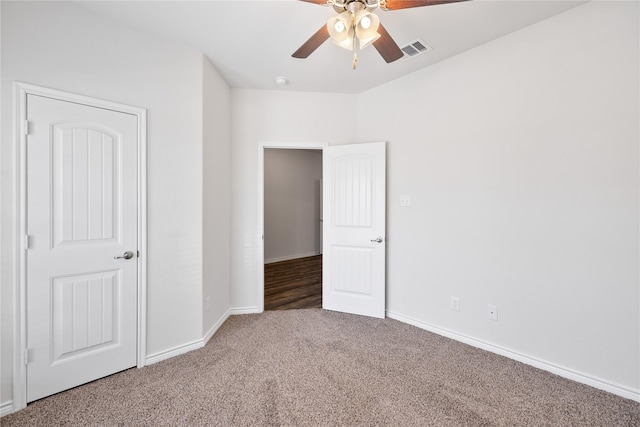 unfurnished bedroom featuring carpet flooring and ceiling fan