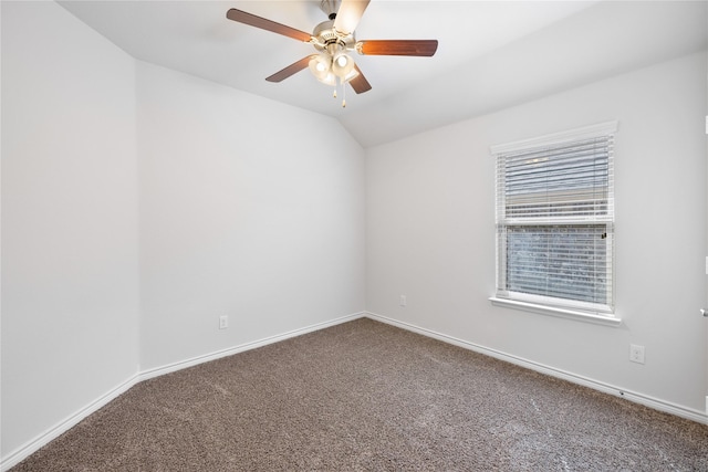 unfurnished room featuring vaulted ceiling, ceiling fan, and carpet flooring