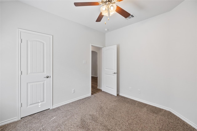 unfurnished bedroom with ceiling fan and carpet flooring