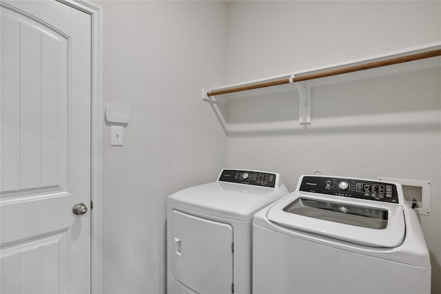 laundry area with separate washer and dryer