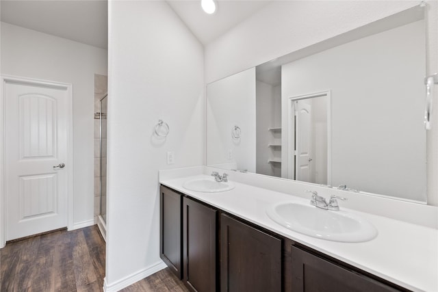 bathroom with vanity, hardwood / wood-style floors, and walk in shower