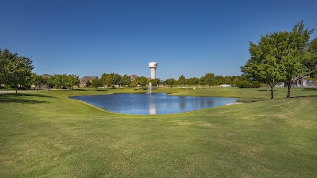 view of home's community featuring a water view and a yard