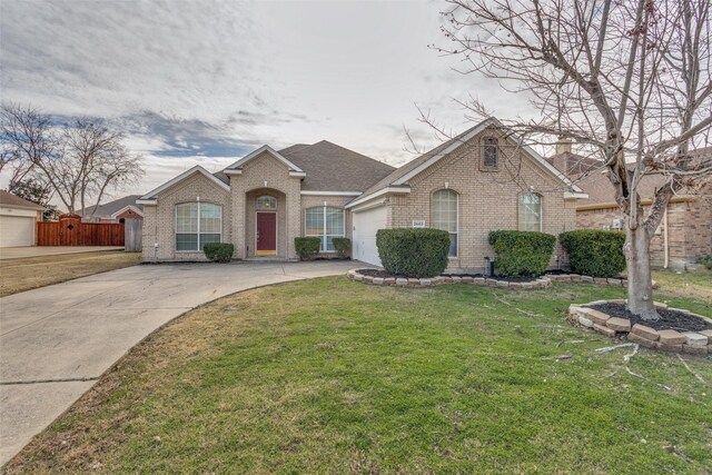 ranch-style home with a front yard and a garage