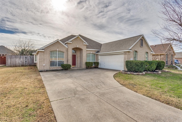 view of front of house featuring a front lawn and a garage