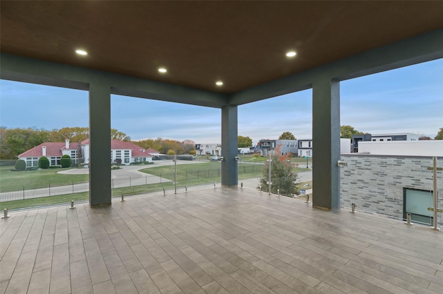 view of patio / terrace featuring fence and a residential view