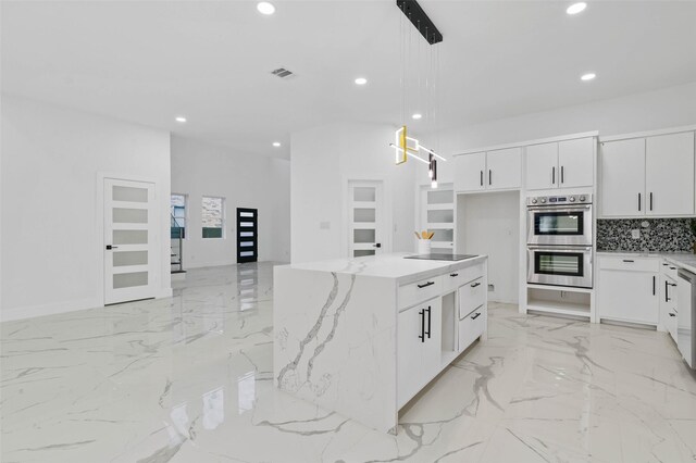 kitchen featuring marble finish floor, stainless steel appliances, white cabinetry, and recessed lighting