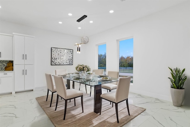 dining room with marble finish floor, baseboards, and recessed lighting