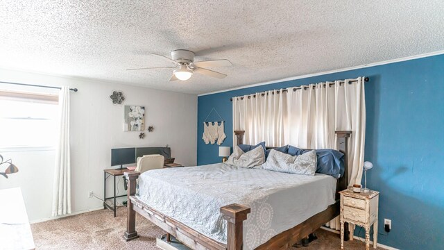 carpeted bedroom with ceiling fan and a textured ceiling