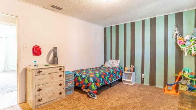 carpeted bedroom featuring a textured ceiling