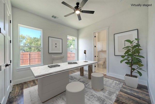 office space featuring dark hardwood / wood-style floors and ceiling fan