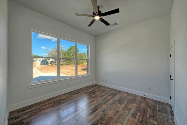 empty room featuring dark hardwood / wood-style floors and ceiling fan