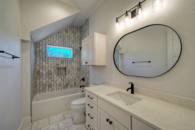 full bathroom featuring tiled shower / bath, vaulted ceiling, vanity, and toilet