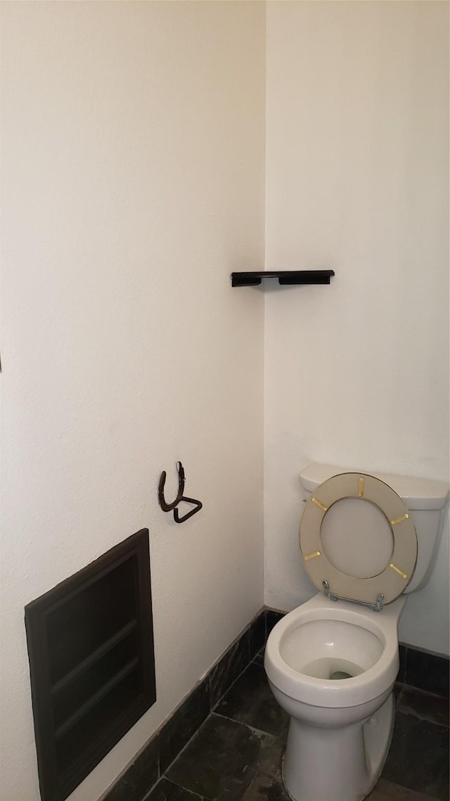 bathroom featuring tile patterned floors and toilet