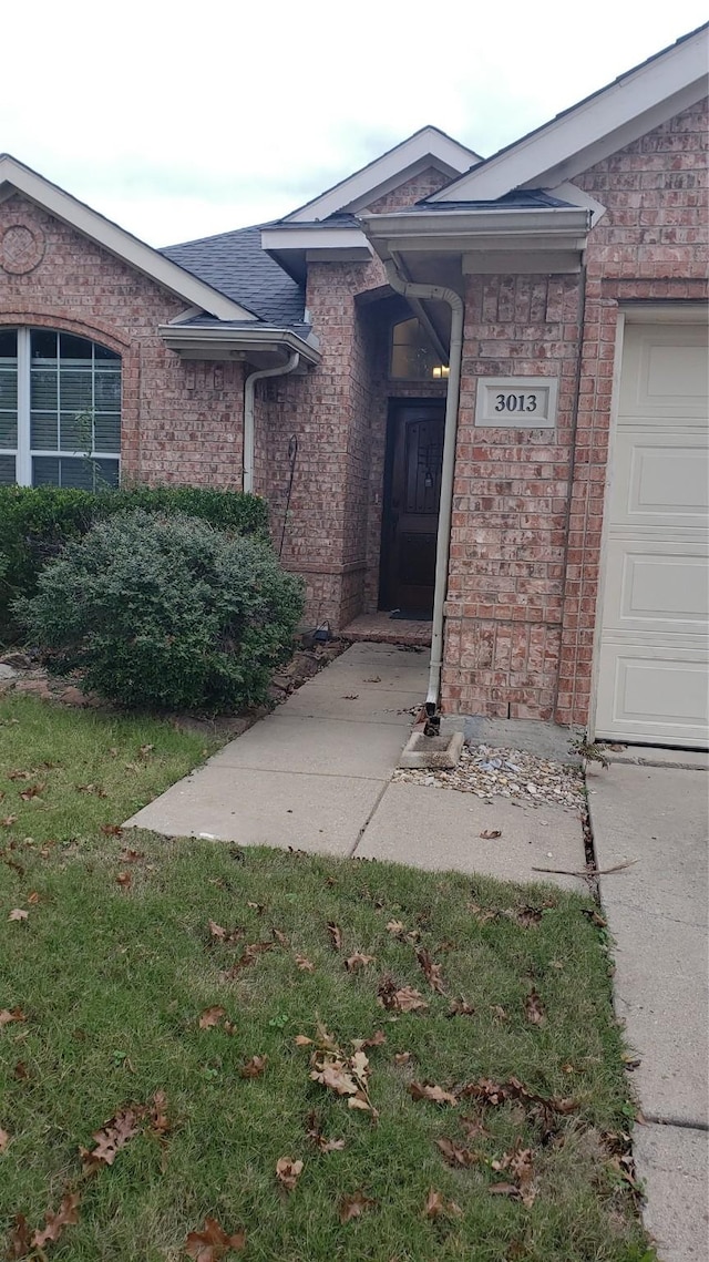 entrance to property featuring a garage